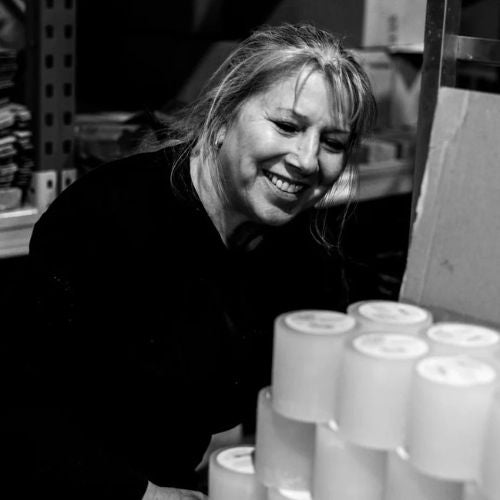 St Eva employee creating the candles